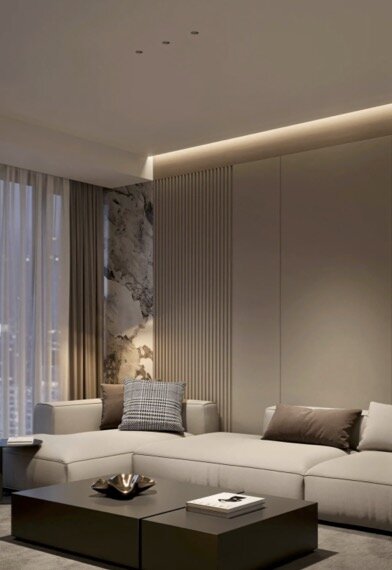A modern living room with concealed cove lighting, ribbed wall panelling and a marble accent — light shaped with intention.